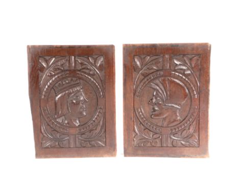 A pair of 17th century oak Romayne-type portrait panels  One carved with the profile bust of a king, wearing a crown, the oth