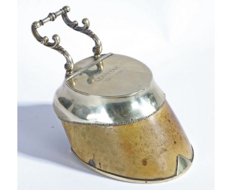 A Victorian horse hoof inkwell, having a silver plated horse shoe mount, scrolled pen holder and hinged lid with interior gla