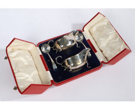 A pair of George V silver sauce boat and sauce ladles, Sheffield 1925, maker Martin Hall &amp; Co Ltd. the sauceboats with do