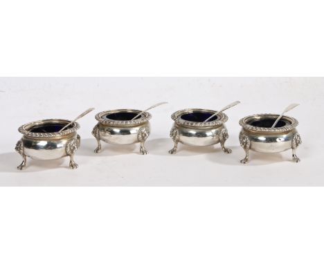 A set of four George III Scottish silver salts, Edinburgh 1815, maker George McHattie, of cauldron form with scroll and gadro