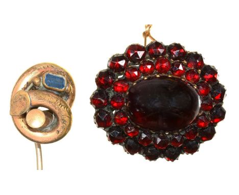 A VICTORIAN BOHEMIAN GARNET AND GILT METAL BROOCH AND A&nbsp;STICK PIN IN GILT BRASS 