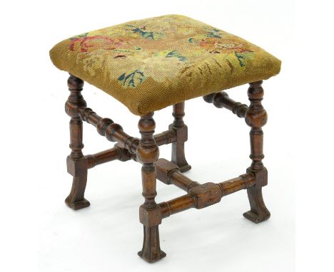 A QUEEN ANNE STYLE WALNUT STOOL ON BRAGANZA FEET, COVERED IN VICTORIAN WOOLWORK, 37 X 37CM, 19TH C 