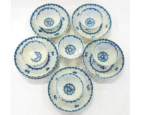 A SET OF SIX CAUGHLEY FLUTED TEA BOWLS AND SAUCERS, TRANSFER PRINTED IN UNDERGLAZE BLUE WITH THE FRUIT AND WREATH PATTERN, SA