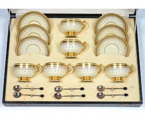 A SET OF SIX GROSVENOR CHINA PRIMROSE YELLOW AND GILT PEDESTAL TEACUPS AND SAUCERS AND A SET OF SIX CONTEMPORARY SILVER BEAN 