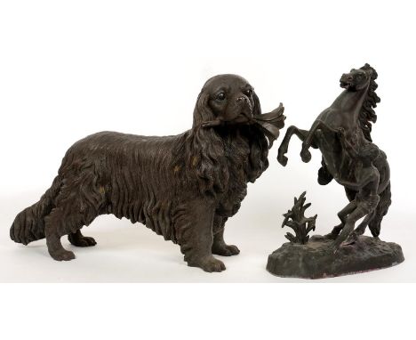 A LIFE SIZED BRONZED RESIN MODEL OF A KING CHARLES SPANIEL AND A FRENCH SPELTER COPY OF ONE OF COUSTOU'S MARLY HORSES, 40CM H