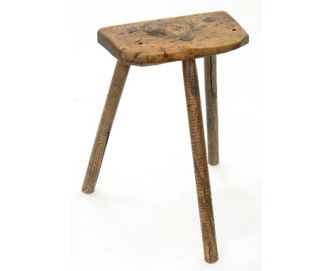 A 19TH C ASH STOOL ON THREE ADZED LEGS, 67CM H 