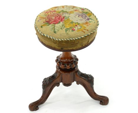 A VICTORIAN CARVED WALNUT PIANO STOOL WITH WOOLWORK SEAT 