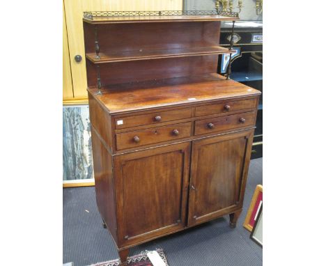 A Regency mahogany chiffonier with two shelf top, on short square legs  