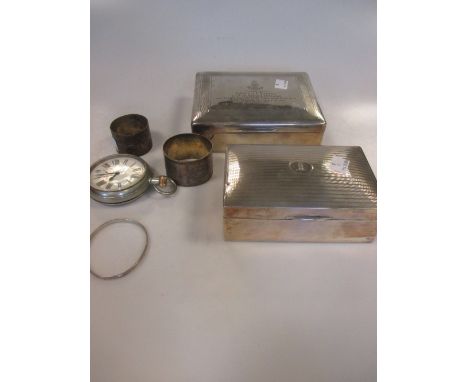 Two silver table cigarette boxes, two napkin rings, a bangle and a pocket watch (6)  