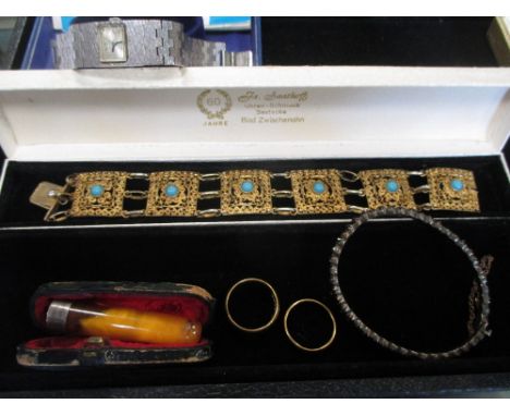 Two 22ct gold wedding rings 12.4g gross, together with a boxed Tissot watch, a boxed amber and silver cigarette holder, a gar