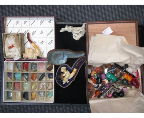 Small hard stone specimens, including an agate cross, and a small pipe  
