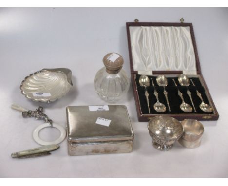 A silver shell shaped butter dish with glass liner, together with a cased set of annointing style teaspoons, a napkin ring, a