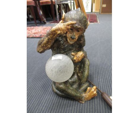 A French table lamp modelled on a monkey or ape&nbsp;