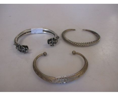 A Chinese bangle and two smaller (3)  