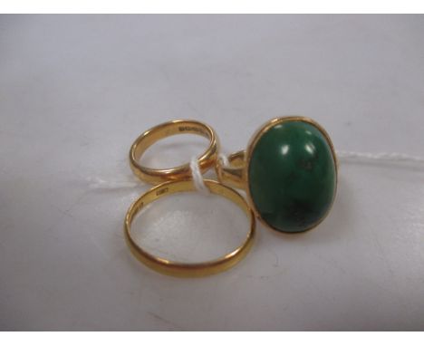 A 22ct gold and moss agate ring and two 22ct wedding bands  