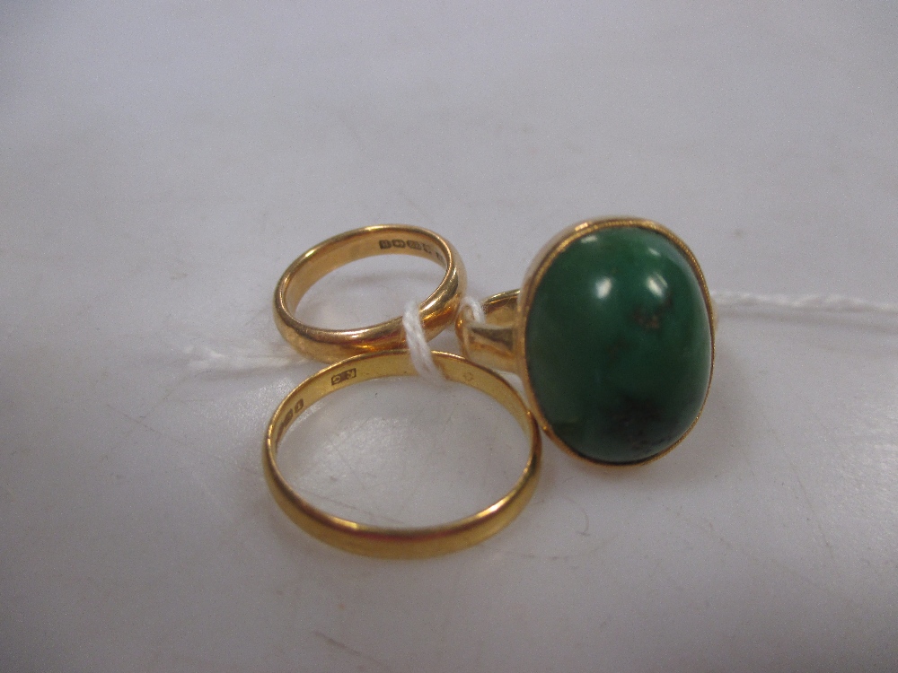 A 22ct gold and moss agate ring and two 22ct wedding bands in ...