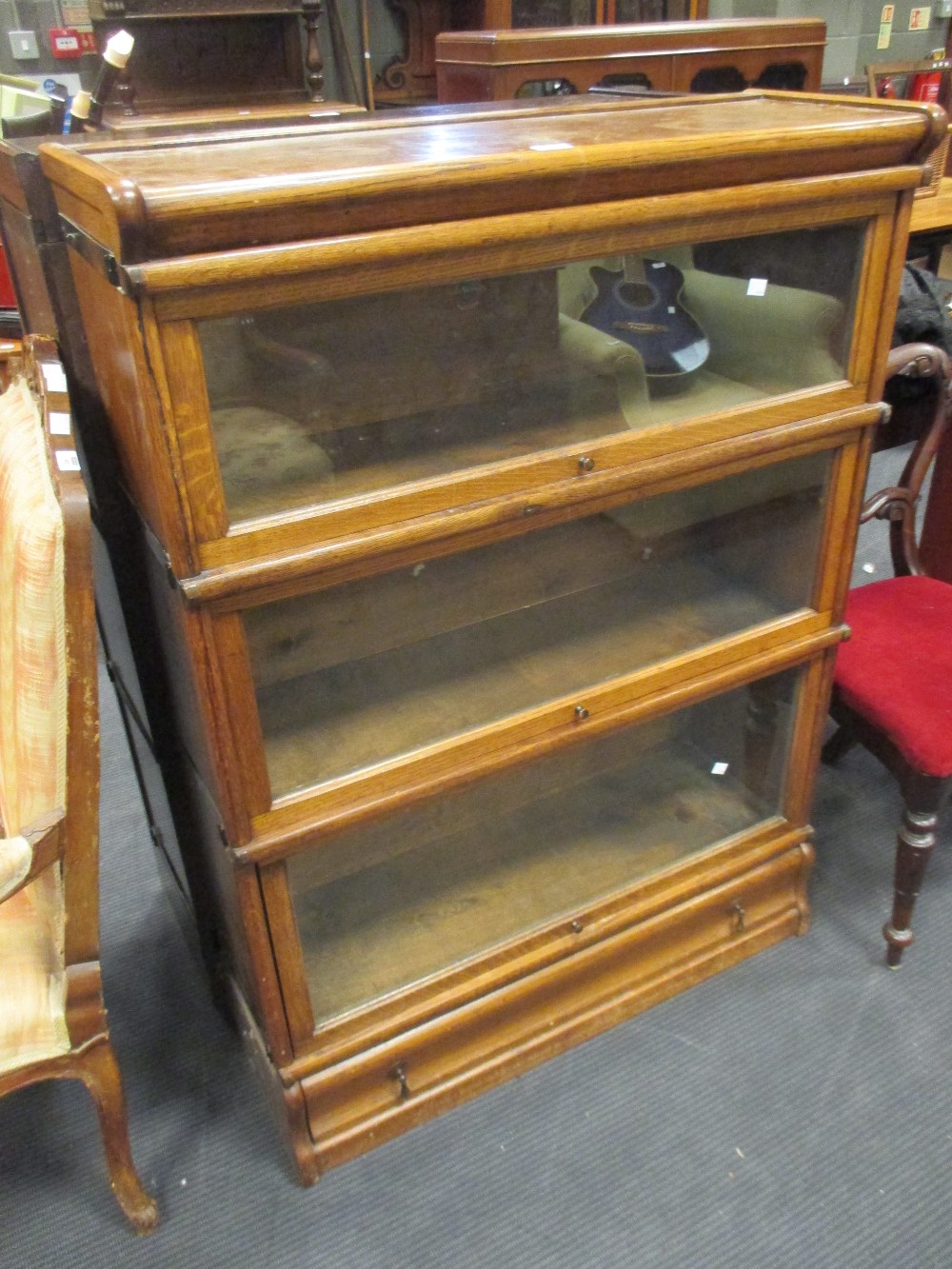 A pair of medium oak Globe Wernicke 3 section stacking bookcases with a