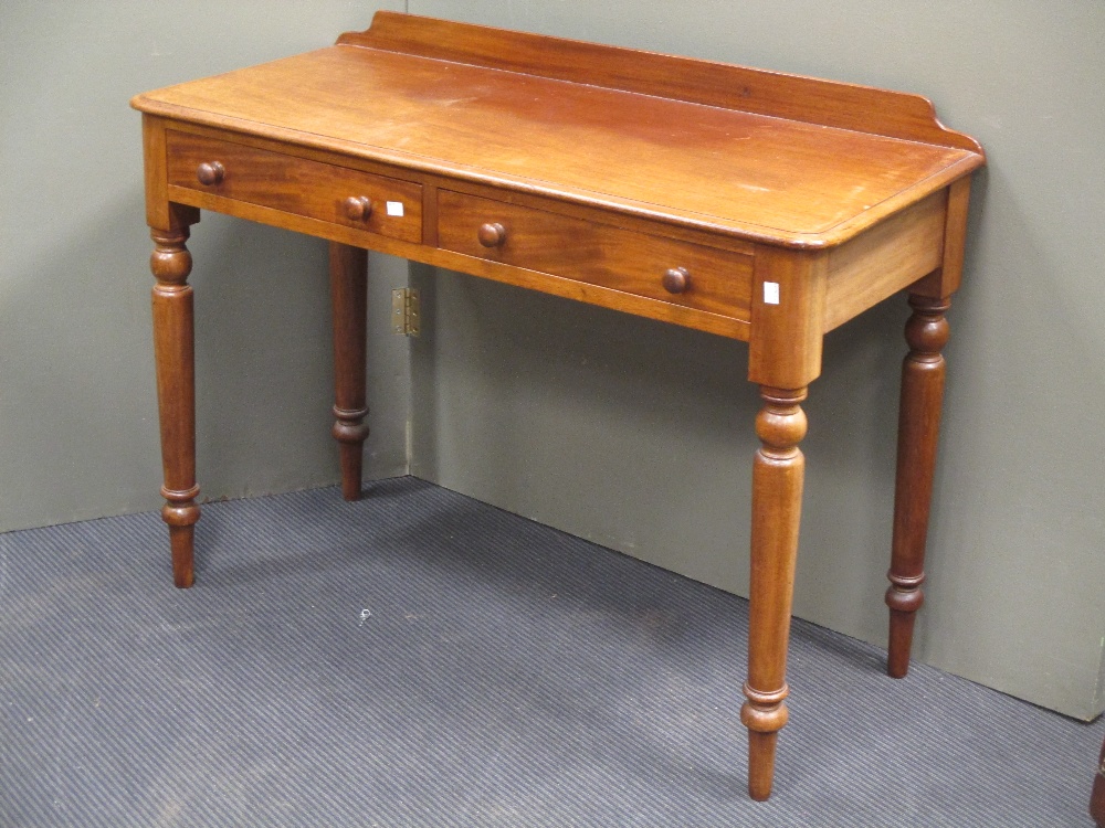 A mahogany two drawer mahogany side table, 105cm wide in Cheffins