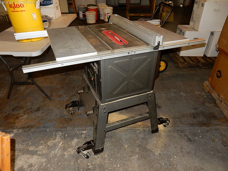 Hitachi table saw model C10FL. Rolling stand, 3HP motor 10" blade. Table measures 27 1/8"x20 1/