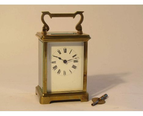 An early 20th Century brass cased  French carriage timepiece with enamelled Roman dial, Swiss liver escapement to platform, w