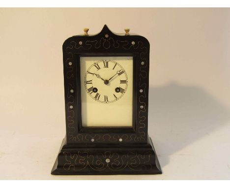 A 19th Century French ebonised mantel clock, possibly re-painted dial, 8 day French drum movement with silk suspension and co