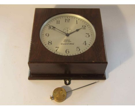 An early 20th Century American Poole electric wall clock in wlanut veneered case with hinged door front, Arabic silvered 8" d