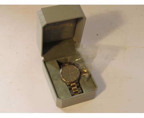 LONGINES: a "Conquest" titanium and gold plated cased quartz bracelet watch with centre seconds and date aperture, case back 