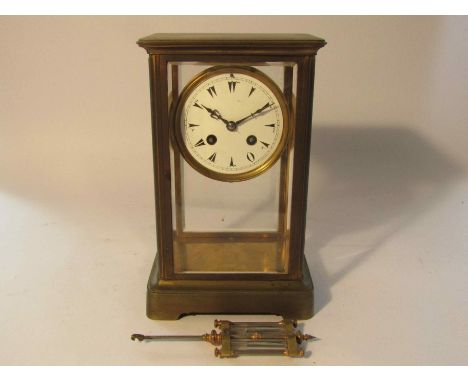 A late 19th Century French brass and four glass mantel clock with 8-day movement by L. Marti, rack strike on a bell, backplat