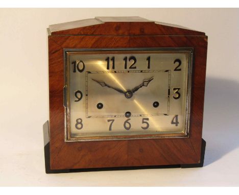 An early to mid 20th Century walnut and ebonised Deco style mantel clock, rectangular Arabic silvered dial with striking and 