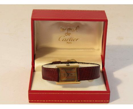 CARTIER: a lady's silver gilt cased "Must de Cartier" manual wind wristwatch with tri-metal striped dial and cabochon sapphir