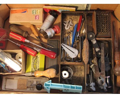 Two boxes of assorted horological tools including tweezers, screwdrivers, pliers, punches, pin vices, vernier, hands, glass f