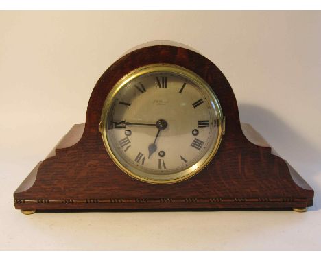 An early to mid 20th Century oak Napoleon hat mantel clock, silvered Roman dial signed J. W. Benson, London, 8 day striking a