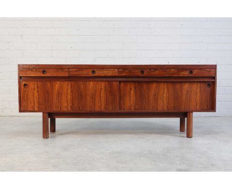 § An Archie Shine rosewood sideboard, 1970s, designed by Robert Heritage (1927-2008), retailed by Heal's, with four parallel 