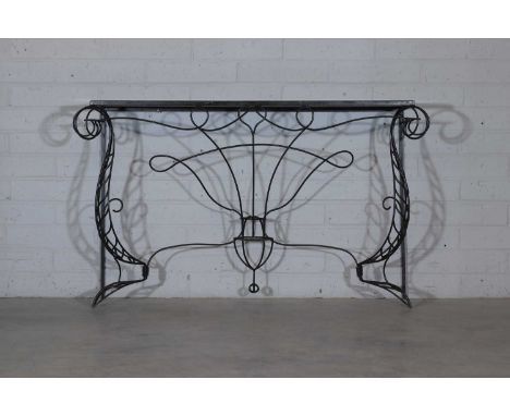 A French wrought-iron console table, in the manner of André Dubreuil, with a plain marble top, the base with scrolled support