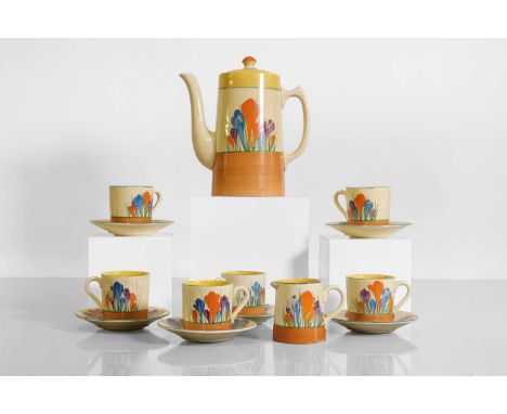 A Clarice Cliff 'Crocus' tankard coffee set,  1930s, painted in colours between yellow and brown bands, comprising: a coffee 