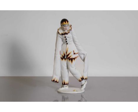 A Rosenthal figure of Pierrot,  by Dorothea Charol, modelled in oversized white clothing with black, red, and yellow trim, on
