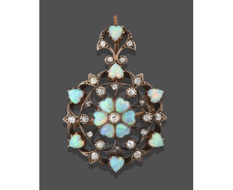 A Victorian Opal and Diamond Brooch/Pendant, comprised of an old cut diamond within six cabochon heart shaped opals, within a