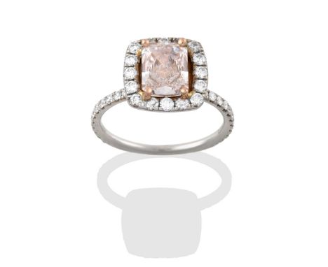 A Diamond Cluster Ring, the central fancy light brownish-pink emerald-cut diamond, in yellow claw settings, within a border o