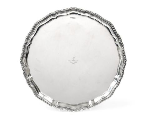 An Edward VII Silver Salver, by Philip Hanson Abbot, Sheffield, 1908, shaped circular and on four panel feet, with gadrooned 