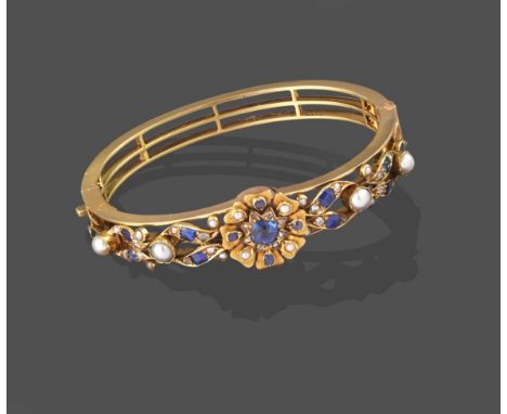 A Sapphire, Diamond and Split Pearl Bangle, the central cluster formed of a cushion cut sapphire within a border of rose cut 