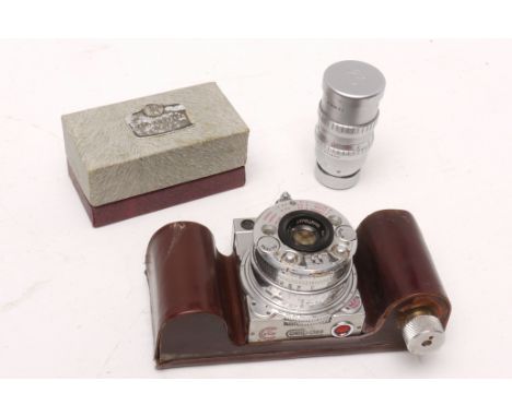 A Compass Camera, No 2702, lacking lens cap and having been modified with a hand made 35mm film back, with a TTH cine lens (a