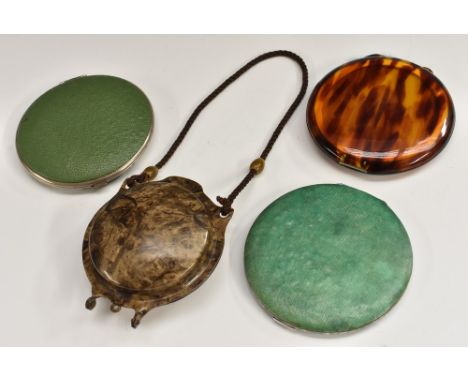 A marbled bakelite powder compact, domed form, short cord handle, Betty Lou puff; a large simulated tortoiseshell compact, go
