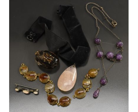 Jewellery - a Gothic amethyst and silver pendant necklace, inset with six circular conical amethyst cabochons above a single 