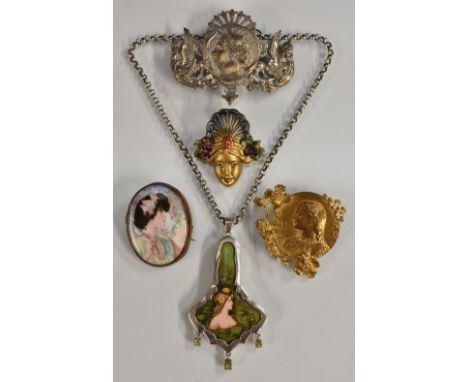 An Art Nouveau style pendant necklace, shaped pendant inset with a panel maiden emerging from the pond, flowers in her hair, 