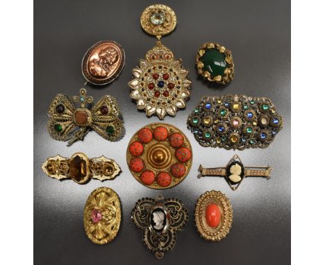 Brooches - a 19th century gilt metal oval brooch set with a central paste aquamarine coloured panel, ornate floral surround; 