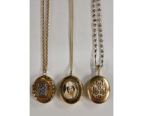 An early 20th century mourning locket, oval photographic portrait within black enamel crest frame, banded agate effect panel 