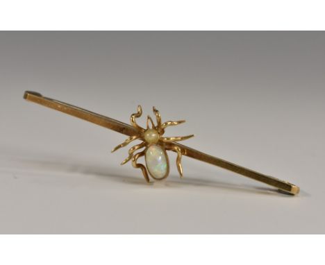 A 9ct gold opal and seed pearl spider bar brooch, plain polished bar mounted with a central spider, seed pearl and opal body,