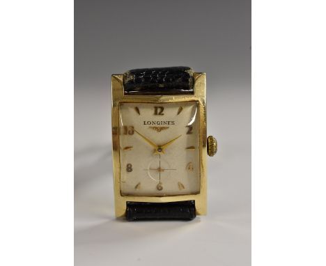 Longines - a vintage 14k gold rectangular tank wristwatch, cream dial, alternating Arabic numerals and arrow batons, subsidia