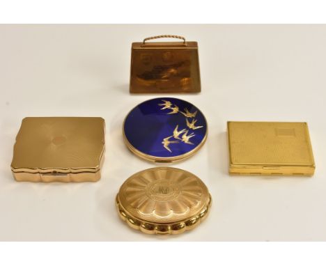 A Mascot novelty lady's souvenir compact as a suitcase, musical, sifter and puff; a Kigu gilt metal compact, engine turned st