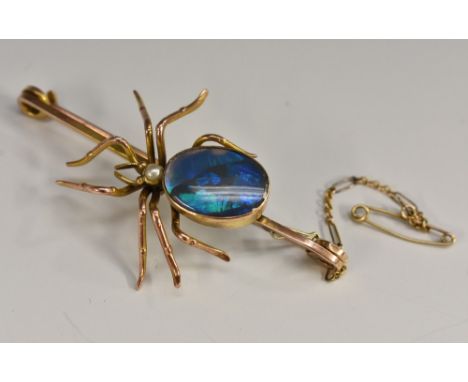 A black opal and seed pearl spider brooch, large black opal abdomen flashing strong blue, violet and green colour play,seed p